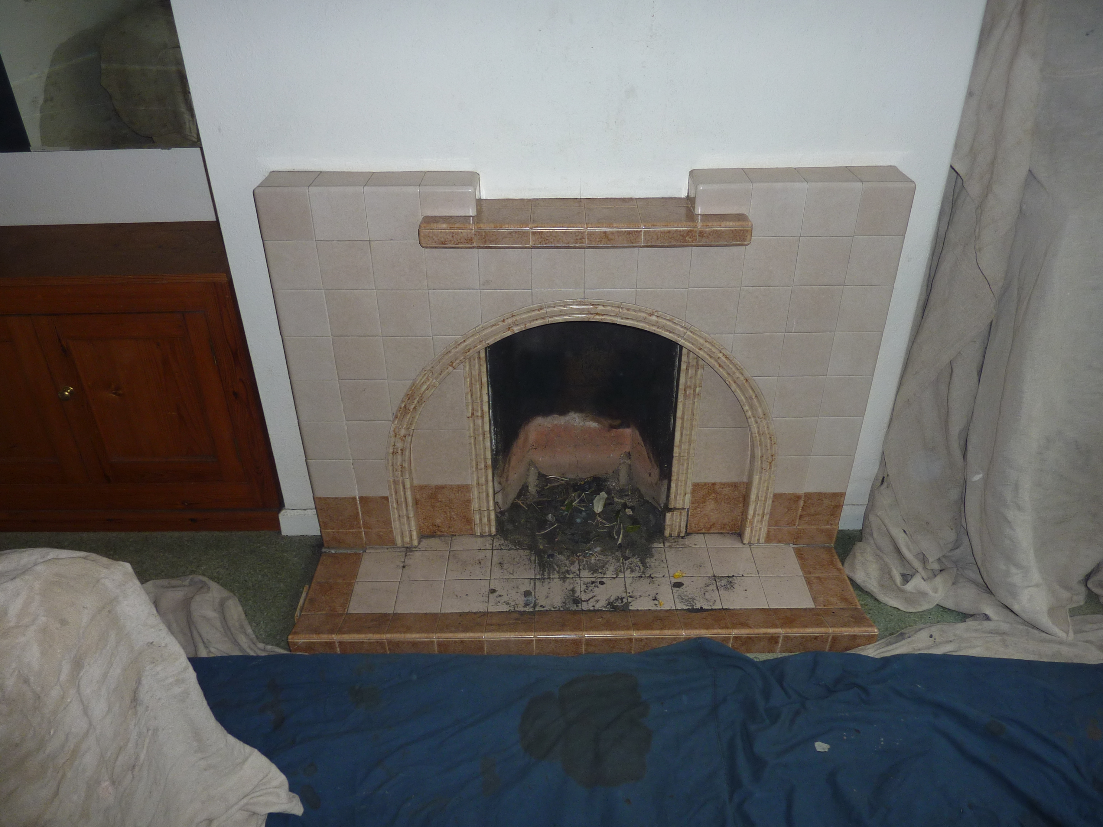 Remove 1950s style fireplace